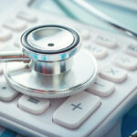 stethoscope on calculator