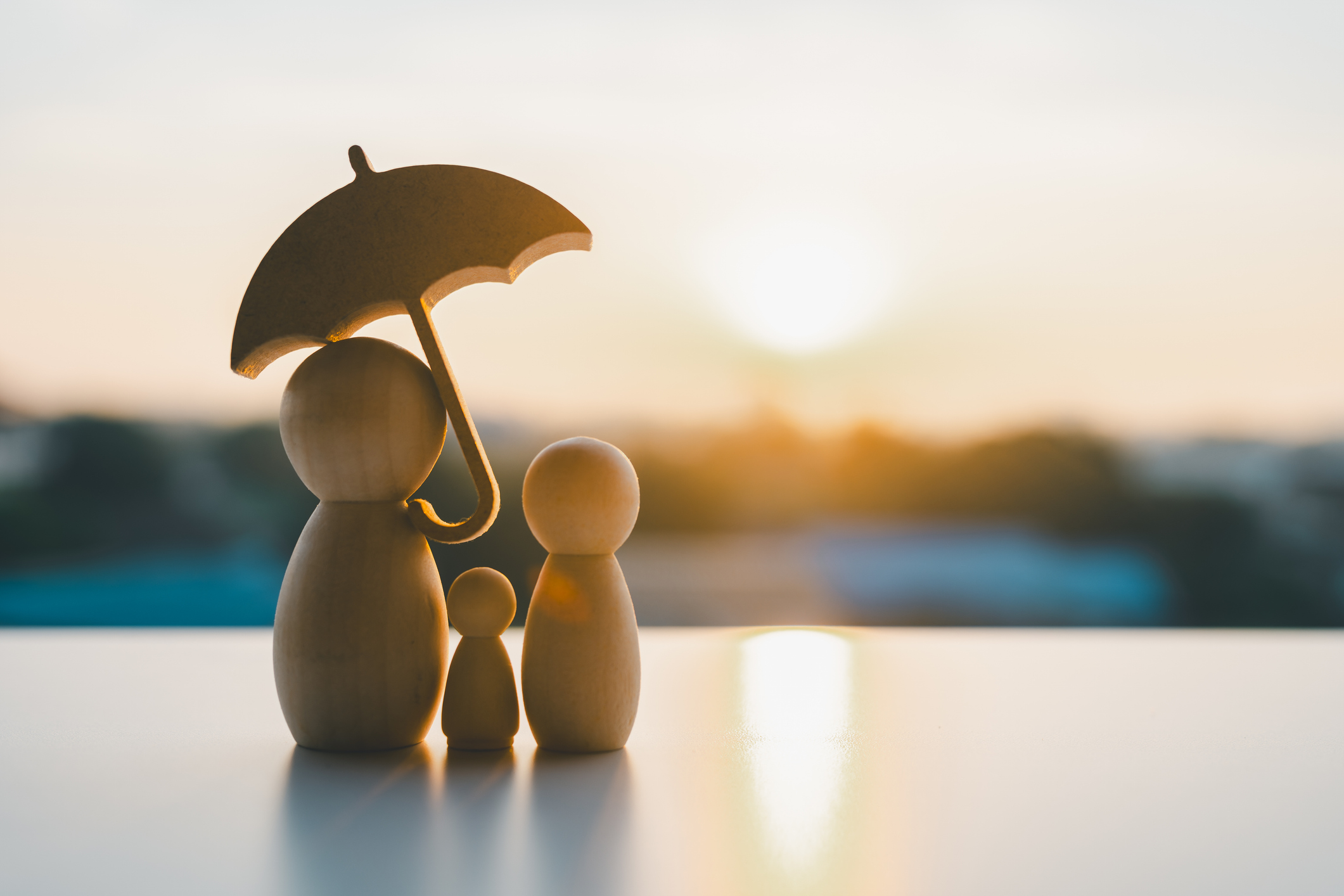 Umbrella icon and family model, Security protection and health insurance. The concept of family home, protection, health care day, car insurance.